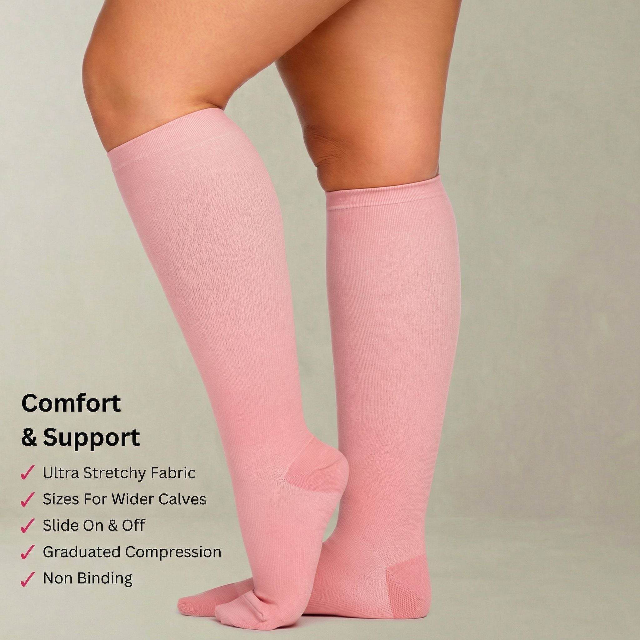 Pink compression socks worn by a person on a plain background with text highlighting features.