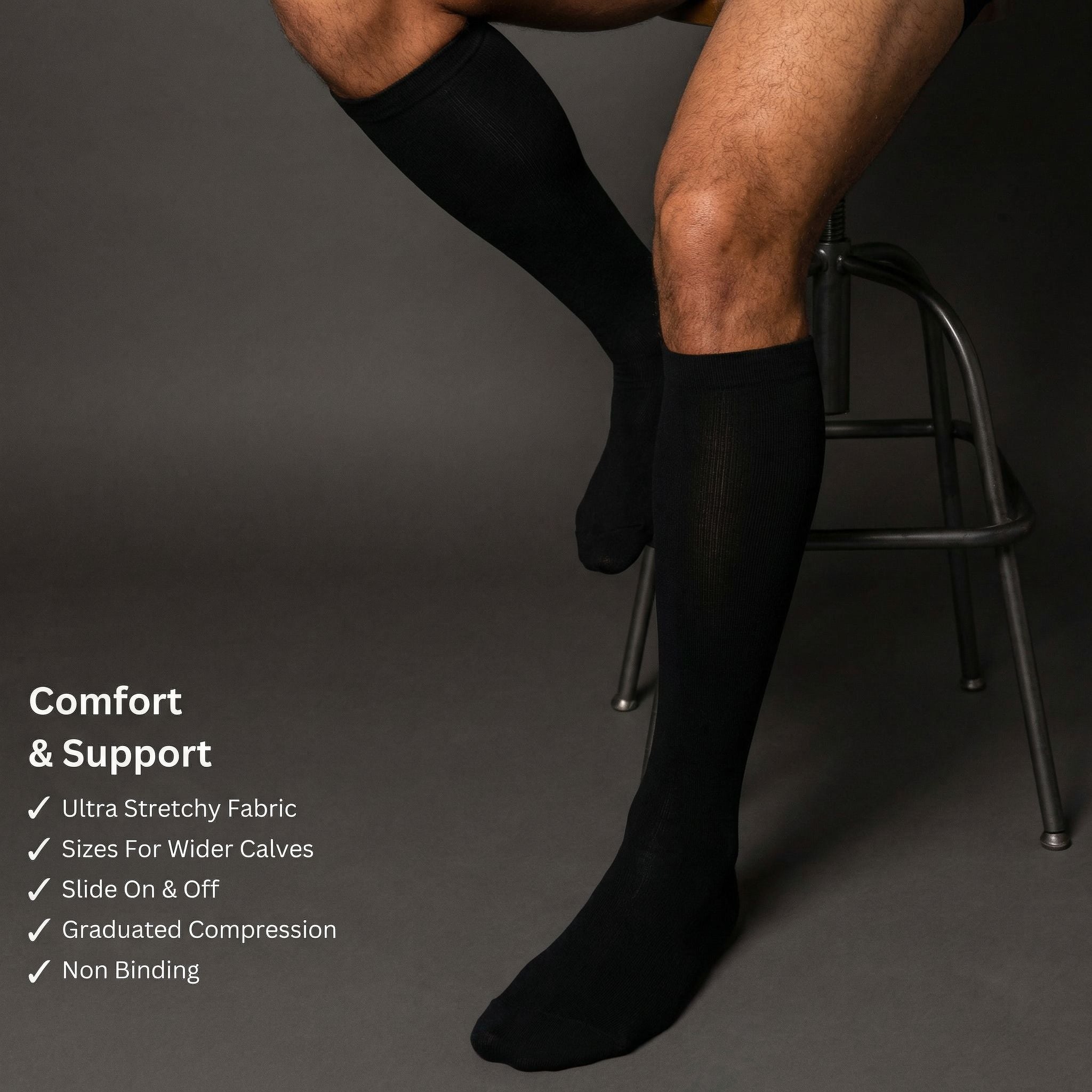 Person wearing black compression socks with text highlighting features on a dark background